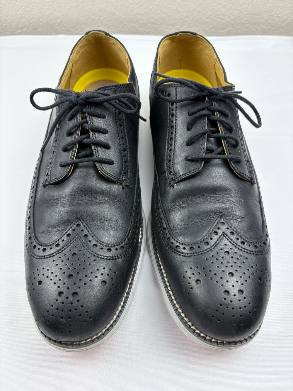 Cole Haan Original Grand wingtip Oxford shoes in black leather.
